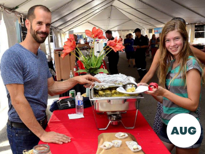 A man serving food to a woman